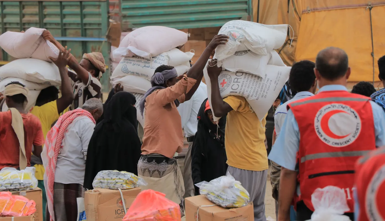 People carrying relief supplies