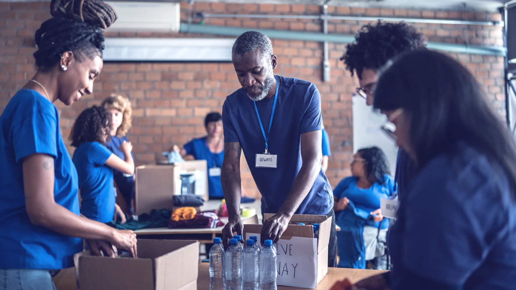 Volunteers preparing resources at an event